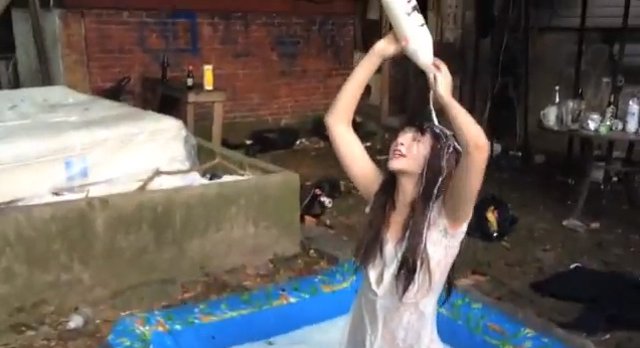 Girl Pouring Milk On Herself