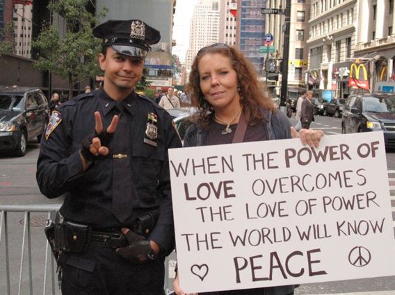 Some Cops Furious NYPD Officer Flashed Peace Sign In Photo With ...