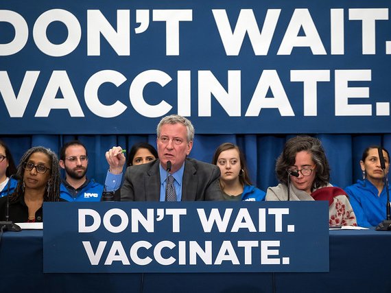 Mayor Bill de Blasio and Health Commissioner Dr. Oxiris Barbot (right) at a press conference in April at the height of the measles outbreak.