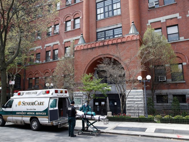 Emergency medical workers arrive at Cobble Hill Health Center in the Brooklyn borough of New York