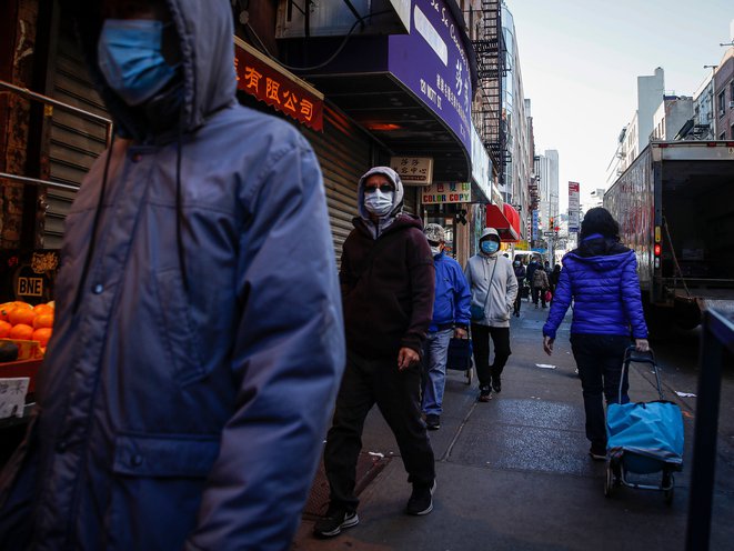 Pedestrians wear face masks in Chinatown on March 16th.