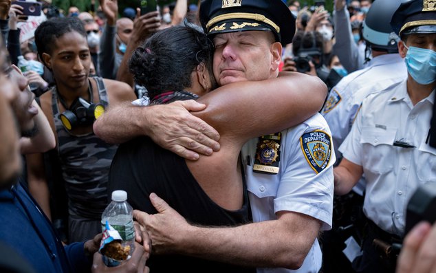 Chief of Department of the New York City Police, Terence Monahan, hugs an activist after he took a knee, on June 1st, 2020.