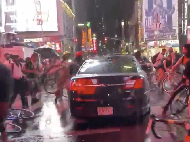 A vehicle seen driving through a crowd of protesters in Times Square on Thursday