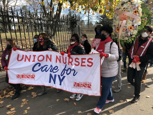 Nurses employed at the Montefiore Health System in the Bronx march through Woodlawn Cemetery, protesting their demands for more nurses.