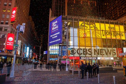 A relatively empty Times Square with confetti in the air