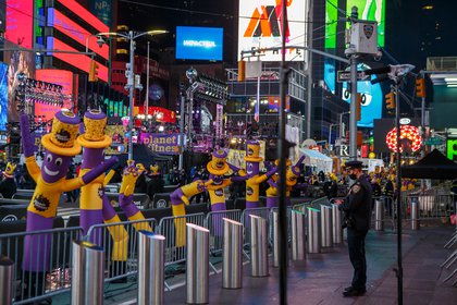 Instead of real crowds, there are a sea of 'tube men'—those inflatable waving figures at car dealerships—in Times Square