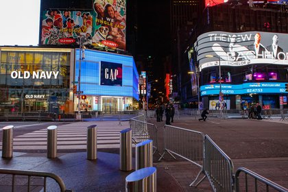 Empty Times Square is set up for the New Year's festivities, with barriers and no crowds