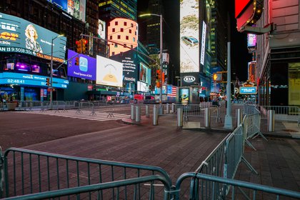 Empty Times Square is set up for the New Year's festivities, with barriers and no crowds