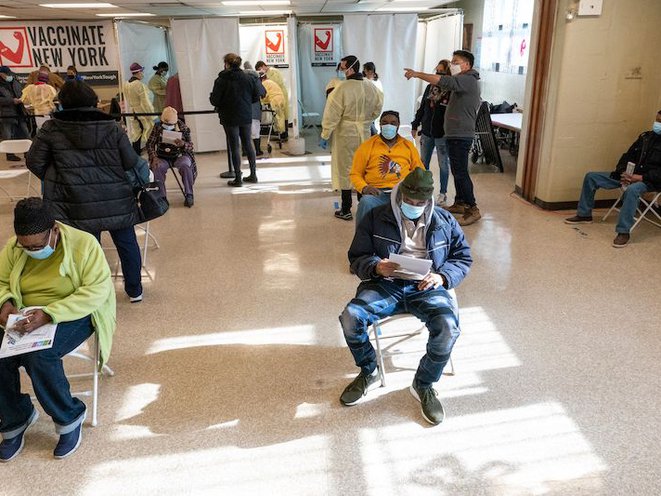 Residents of the William Reid Apartments rest for a few minutes after receiving the first dose of the COVID-19 vaccine at a pop-up vaccination site in the William Reid Houses NYCHA housing complex in Brooklyn.