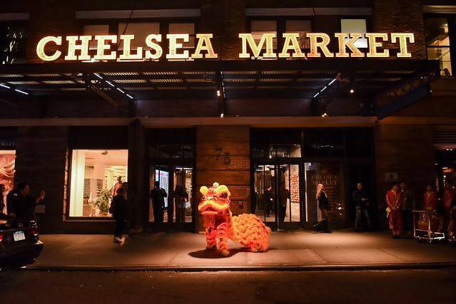 A Chinese Lion dancer in costume outside Chelsea Market