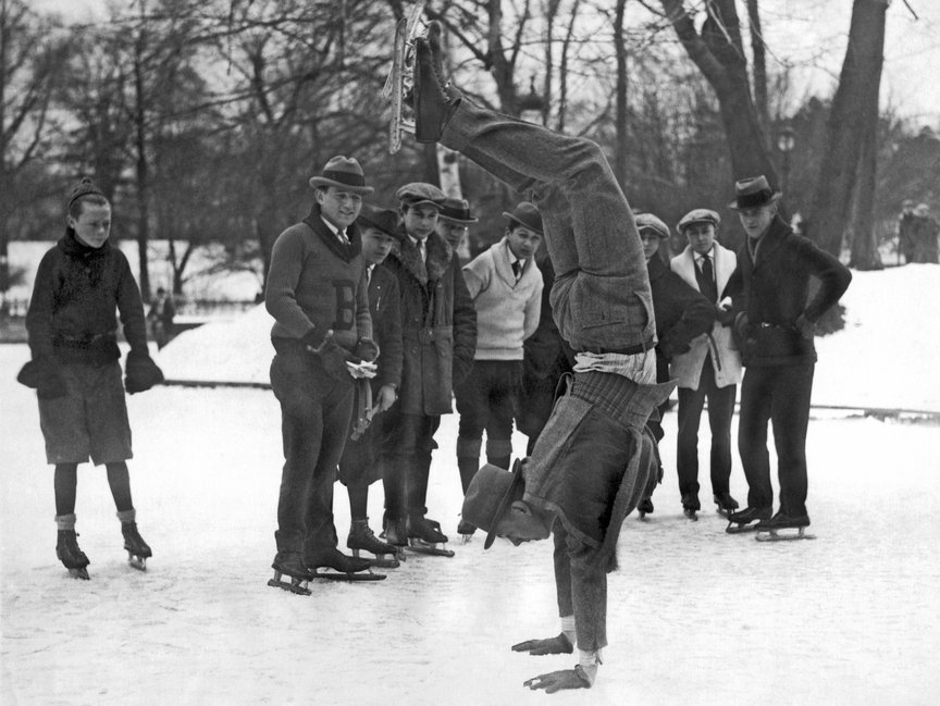 An ice skater amuses a crowd with his hand springs in Brooklyn, January 18, 1923.