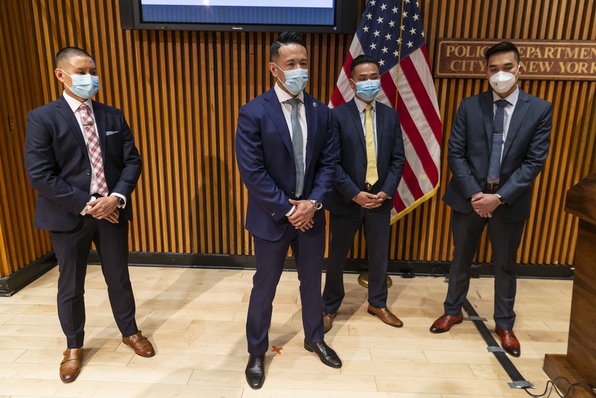 Four detectives from the Asian Hates Crimes Task Force stand during a press conference in August 2020