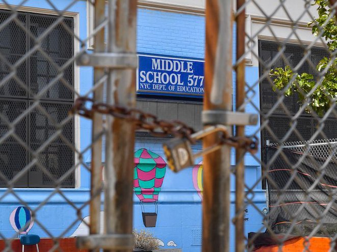 A padlocked gate outside Middle School 577 in Williamsburg, Brooklyn.