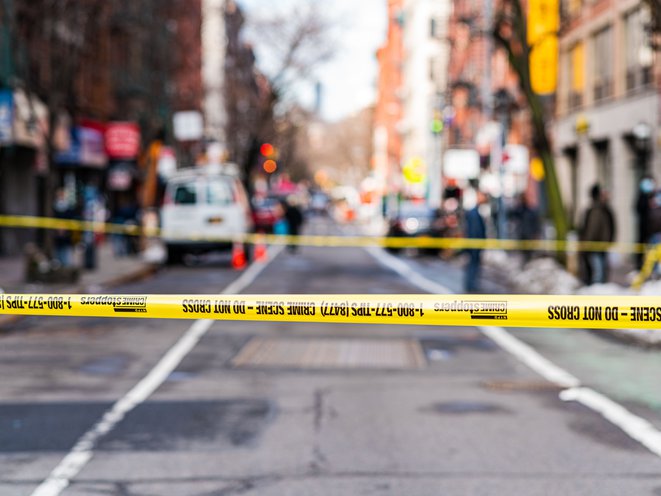 NYC police investigate the scene where shots were fired from a car that was driving in the LES. A 57 year old woman who was an innocent bystander was struck. February 16, 2021
