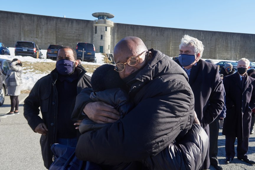 George Bell embraces his family after walking out of prison.