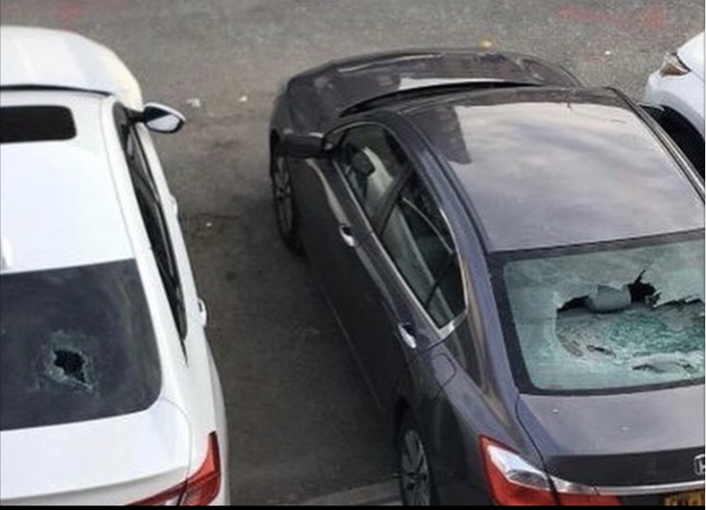 The damaged vehicles outside the NYPD's 90th precinct
