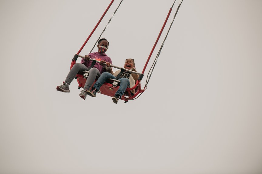 A photo of kids on a ride at Coney Island on April 9th, 2021
