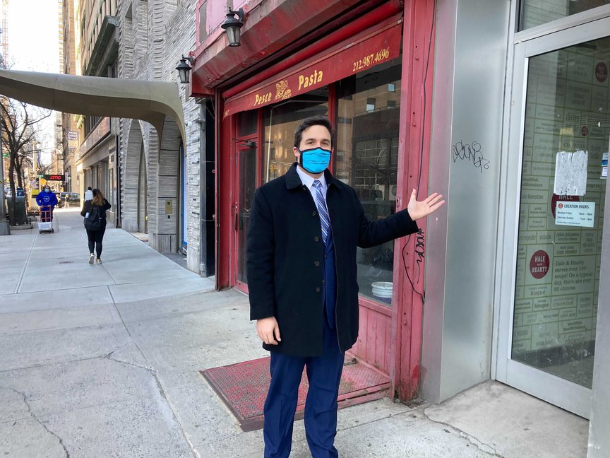 Vacant storefronts along Third Avenue, with City Council member Ben Kallos gesturing in front of them