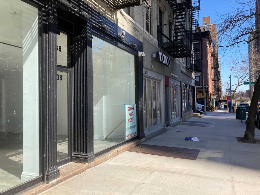 Empty storefronts along Third Avenue with a 