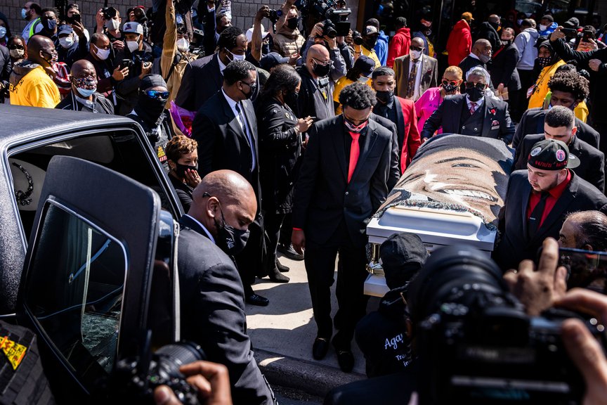 Brothers and friends of Daunte Wright carry his casket, draped with a blanket bearing his face