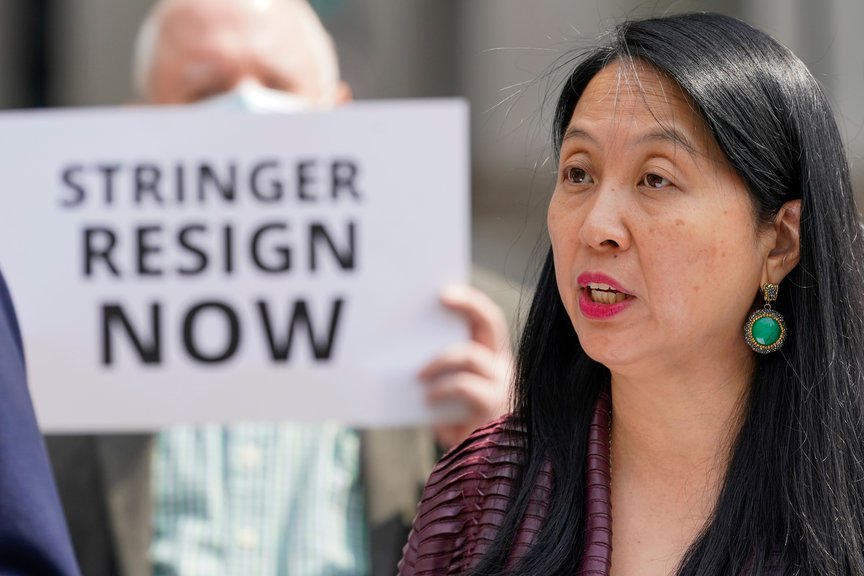 Jean Kim speaks to reporters during a news conference in Manhattan.