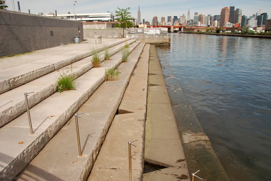 A granite staircase descending into the Newtown Creek, in 2012