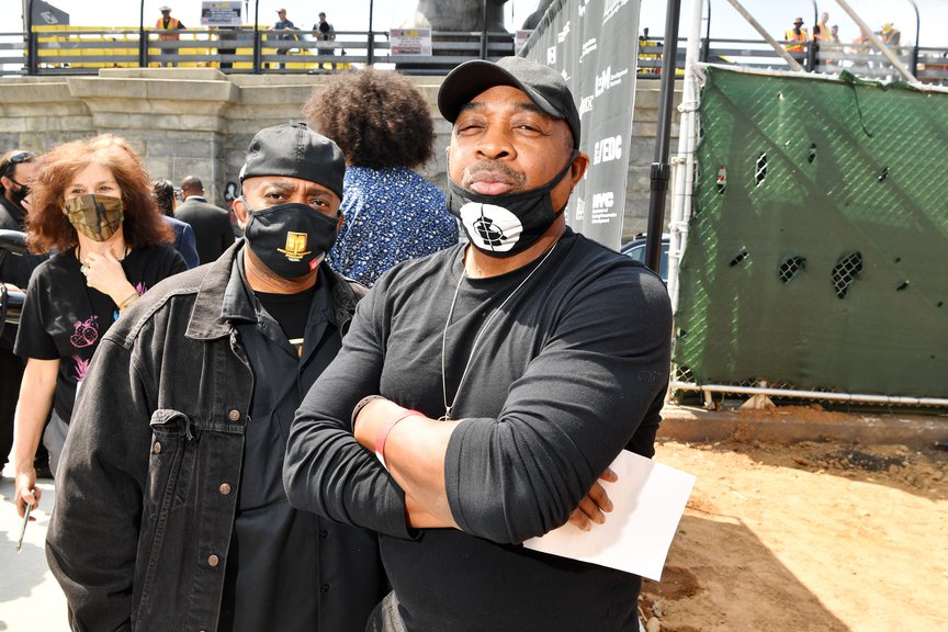 Chuck D stands with arms crossed near the groundbreaking