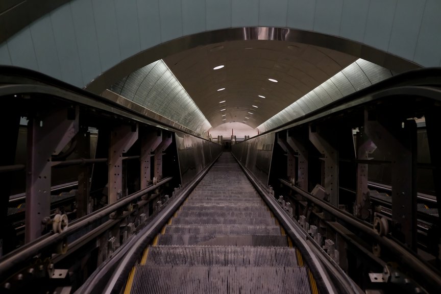 A cavernous escalator tunnel