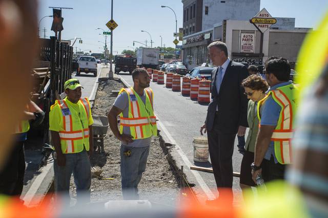 Mayor bill de blasio and DOT commissioner Polly trottenberg speak to DOT workers who are creating a median