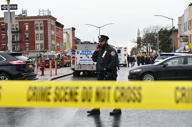 An NYPD officer on scene after a shooting in Sunset Park, Brooklyn.