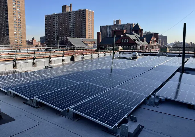 New solar panels on a rooftop in Clinton Hill will produce around 4,000 kilowatt hours of energy per month once the installation is complete.