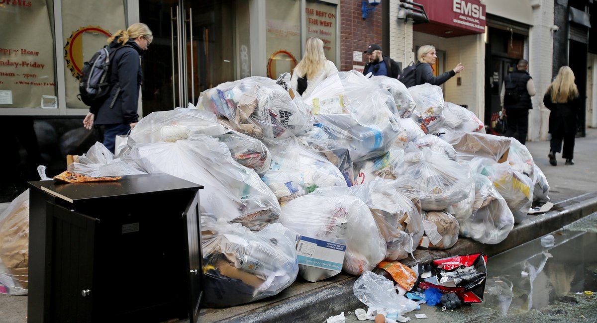 Ban on trash bag piles in entrance of all NYC companies