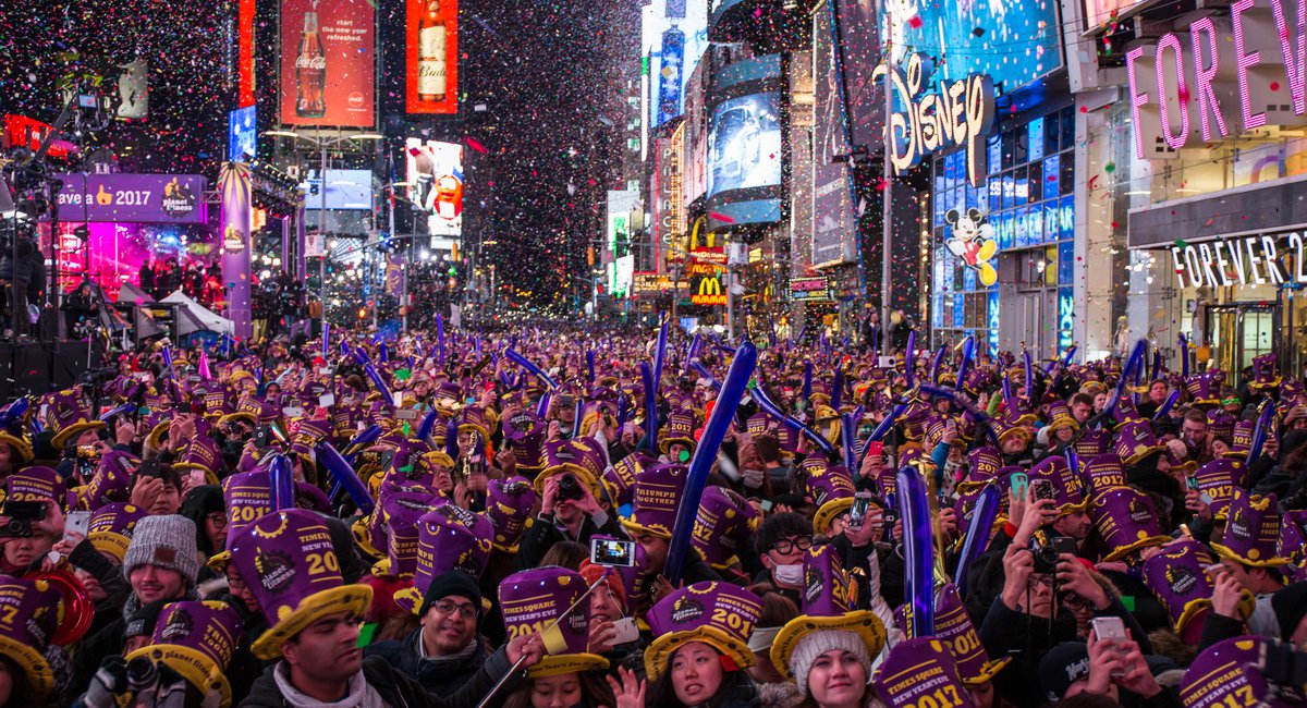 huge crowd of people in times square celebrating new years